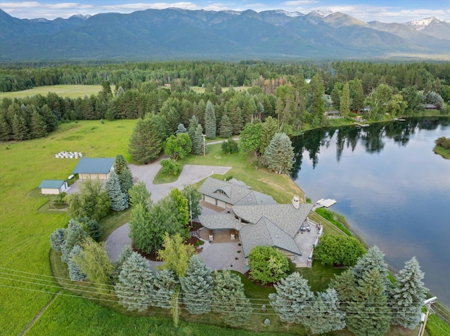 639 Three Eagle Ln, Bigfork, MT 59911 - view from above of property featuring a forest and a water and mountain view