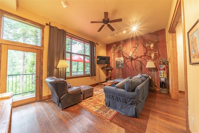 439 Osborn Ave Unit 115, Bigfork, MT 59911 - living area featuring wood finished floors, rail lighting, and ceiling fan