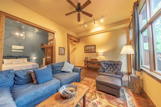 439 Osborn Ave Unit 115, Bigfork, MT 59911 - living area featuring track lighting, wood finished floors, a ceiling fan, and healthy amount of natural light
