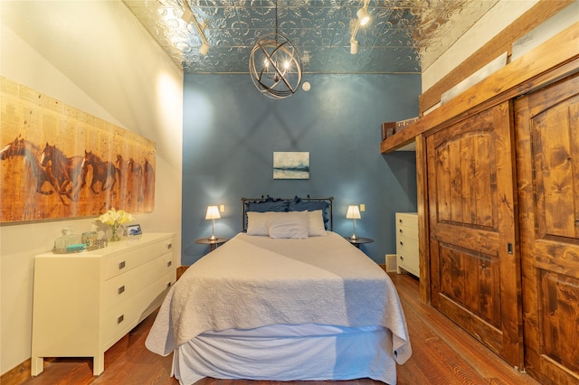 439 Osborn Ave Unit 115, Bigfork, MT 59911 - bedroom with an ornate ceiling and wood finished floors