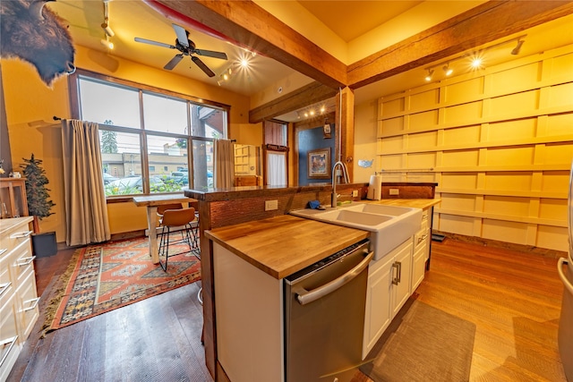 439 Osborn Ave Unit 115, Bigfork, MT 59911 - kitchen featuring dishwasher, dark wood-style floors, butcher block countertops, and a ceiling fan
