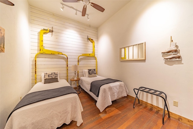 439 Osborn Ave Unit 115, Bigfork, MT 59911 - bedroom featuring wood finished floors, a ceiling fan, and wood walls