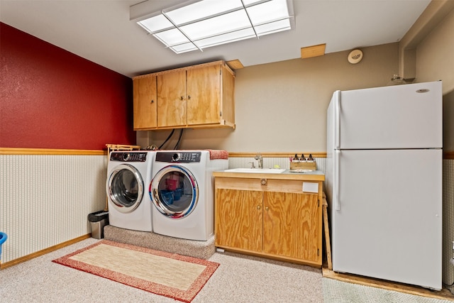 487 Hudson Ln, Victor, MT 59875 - laundry room with cabinet space, washing machine and clothes dryer, and light colored carpet