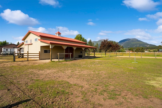 487 Hudson Ln, Victor, MT 59875 - view of yard featuring an exterior structure, a mountain view, and an outdoor structure