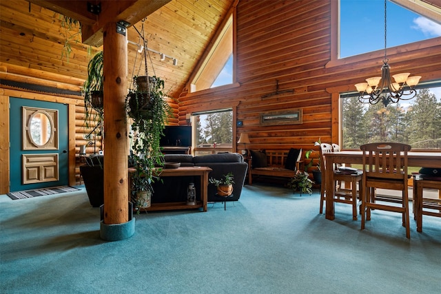 487 Hudson Ln, Victor, MT 59875 - carpeted living room featuring high vaulted ceiling, a chandelier, log walls, and wooden ceiling