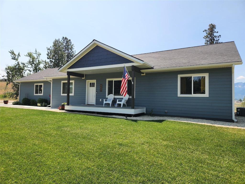5369 Sunnyvale Ct, Florence, MT 59833 - back of property with a lawn and a porch
