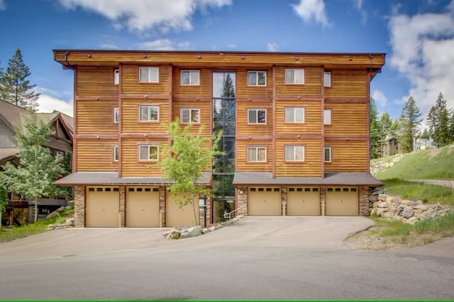 3832 Tamarack Ave Unit 2B, Whitefish, MT 59937 - view of property featuring a garage and driveway