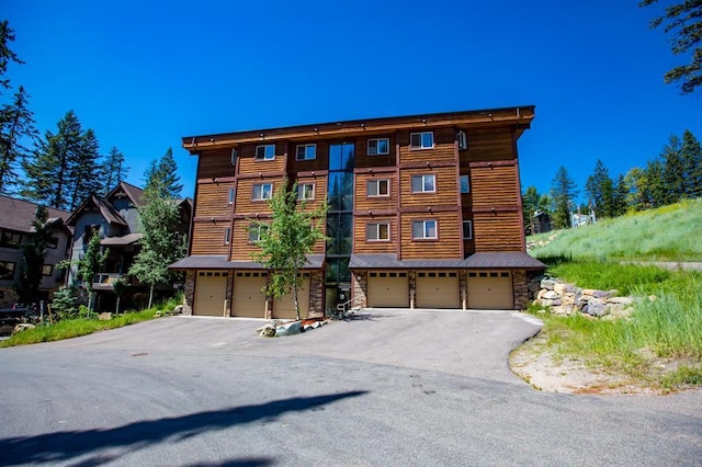 3832 Tamarack Ave Unit 2B, Whitefish, MT 59937 - view of property with a garage and driveway