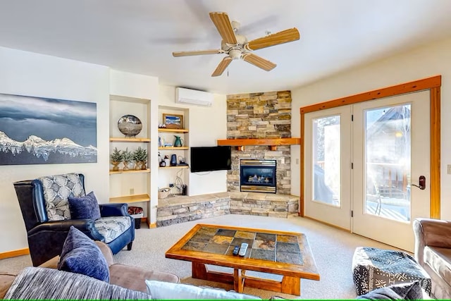 3832 Tamarack Ave Unit 2B, Whitefish, MT 59937 - carpeted living room featuring a wall unit AC, a ceiling fan, a fireplace, and built in shelves