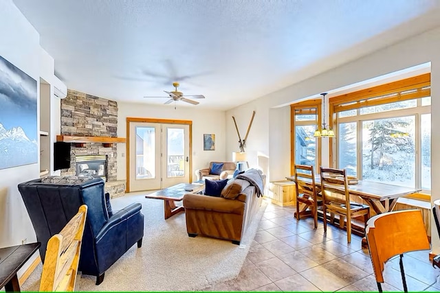 3832 Tamarack Ave Unit 2B, Whitefish, MT 59937 - living room featuring healthy amount of natural light, a ceiling fan, a fireplace, and light tile patterned floors