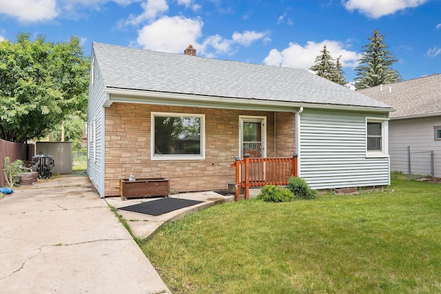 1307 4th St W, Kalispell, MT 59901 - view of front facade with a shingled roof, a chimney, and stone siding