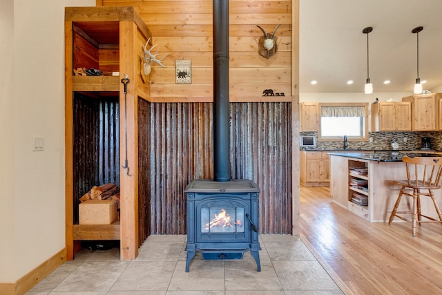 109 Como Vista Ln, Hamilton, MT 59840 - detailed view of decorative backsplash, a wood stove, recessed lighting, and wood finished floors