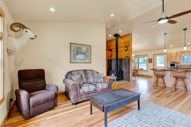 109 Como Vista Ln, Hamilton, MT 59840 - living area featuring a wood stove, light wood-type flooring, recessed lighting, a ceiling fan, and vaulted ceiling
