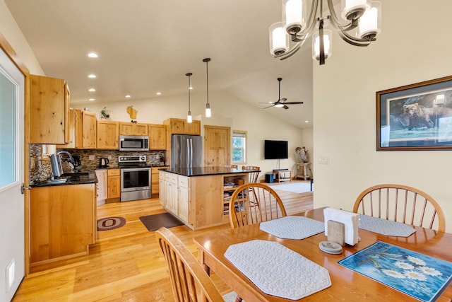 109 Como Vista Ln, Hamilton, MT 59840 - dining space with a chandelier, light wood-type flooring, vaulted ceiling, a ceiling fan, and recessed lighting