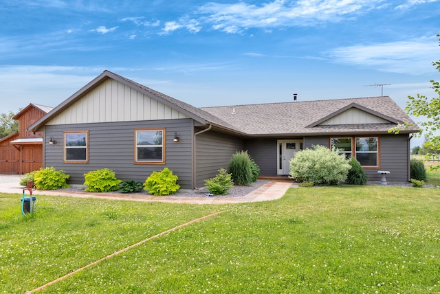 109 Como Vista Ln, Hamilton, MT 59840 - view of front facade with a front lawn, a shingled roof, and board and batten siding