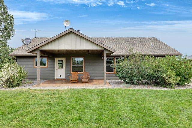 109 Como Vista Ln, Hamilton, MT 59840 - rear view of house with roof with shingles and a yard
