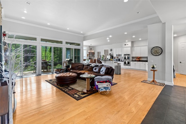 20245 Swan View Rd, Rollins, MT 59931 - living room with crown molding, healthy amount of natural light, a chandelier, recessed lighting, and light wood-style flooring