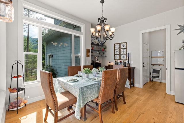 20245 Swan View Rd, Rollins, MT 59931 - dining area featuring light wood finished floors and a chandelier