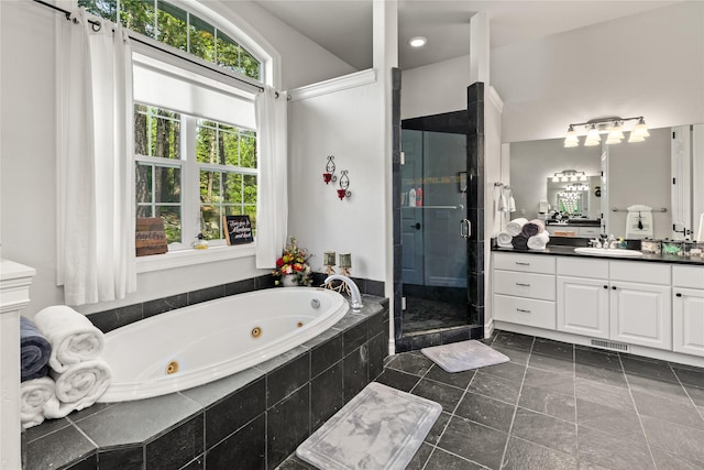 20245 Swan View Rd, Rollins, MT 59931 - bathroom with vanity, a stall shower, a tub with jets, and tile patterned floors