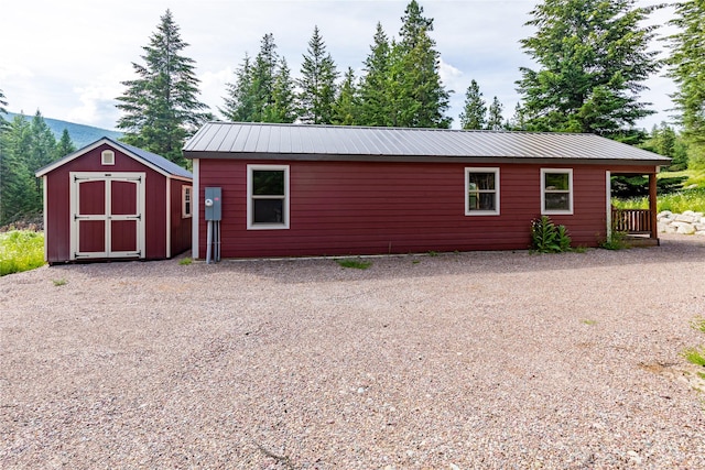 20245 Swan View Rd, Rollins, MT 59931 - view of side of property with a shed and a metal roof