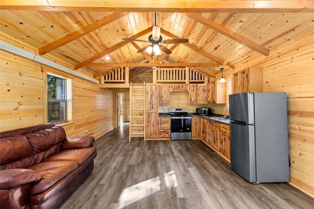 20245 Swan View Rd, Rollins, MT 59931 - kitchen with appliances with stainless steel finishes, wood walls, open floor plan, dark countertops, and wood ceiling