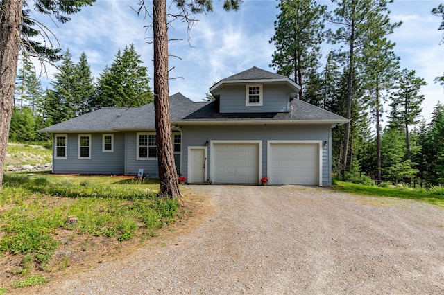 20245 Swan View Rd, Rollins, MT 59931 - view of front of property featuring driveway, a garage, and a shingled roof