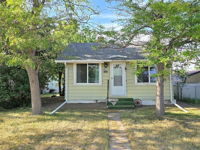 1111 6th Ave NW, Great Falls, MT 59404 - bungalow-style home featuring entry steps, a chimney, and a shingled roof