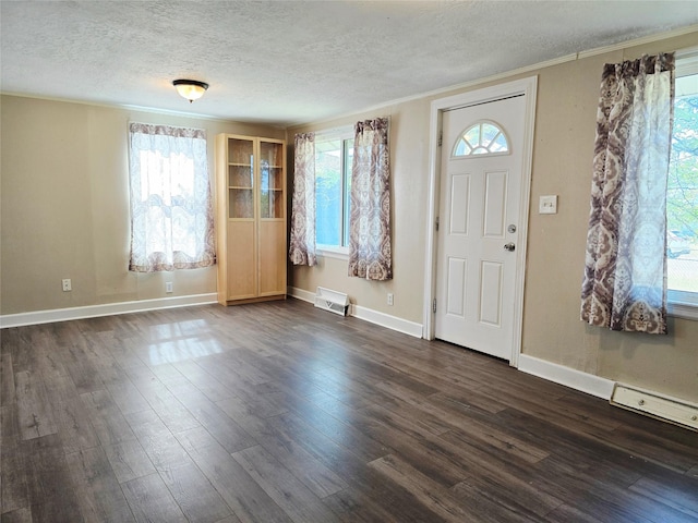 1111 6th Ave NW, Great Falls, MT 59404 - foyer with a textured ceiling, dark wood finished floors, and ornamental molding