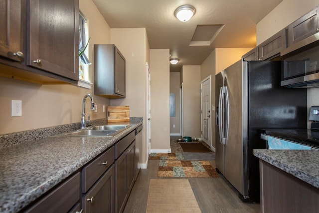 618 W Adams St, Three Forks, MT 59752 - kitchen featuring stainless steel appliances, dark brown cabinets, and dark wood-style floors