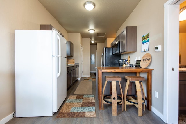 618 W Adams St, Three Forks, MT 59752 - kitchen featuring appliances with stainless steel finishes and dark wood-style floors