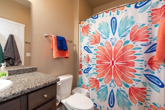 618 W Adams St, Three Forks, MT 59752 - full bath featuring vanity, a textured wall, and a shower with curtain