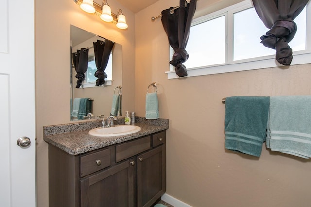 618 W Adams St, Three Forks, MT 59752 - bathroom featuring vanity and plenty of natural light