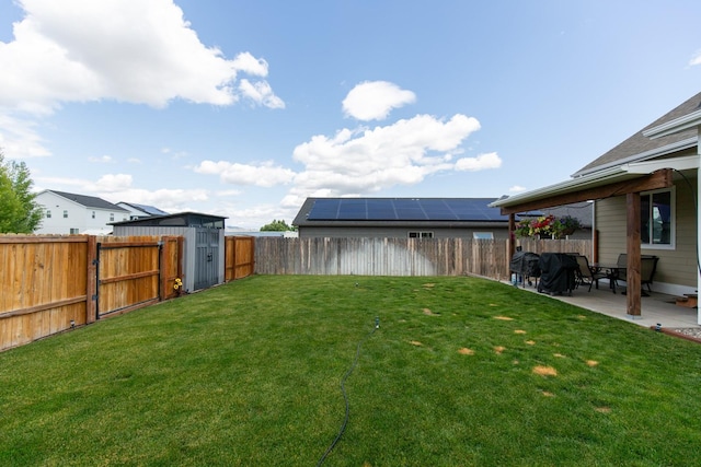 618 W Adams St, Three Forks, MT 59752 - fenced backyard with a patio and a storage shed