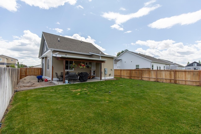 618 W Adams St, Three Forks, MT 59752 - rear view of house featuring a patio, a fenced backyard, and roof with shingles