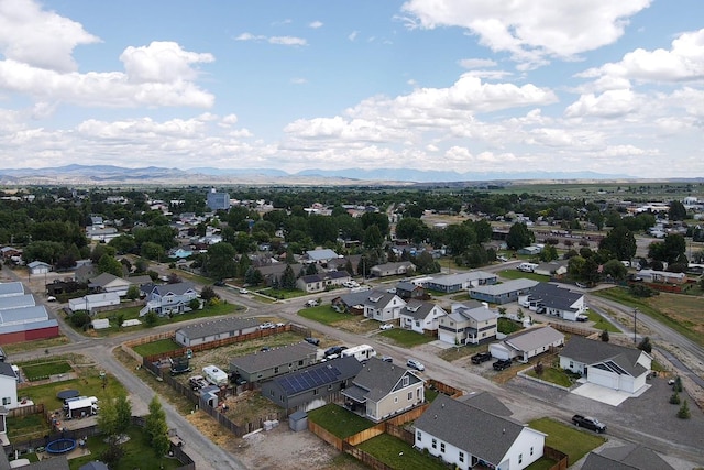 618 W Adams St, Three Forks, MT 59752 - aerial perspective of suburban area featuring a mountainous background