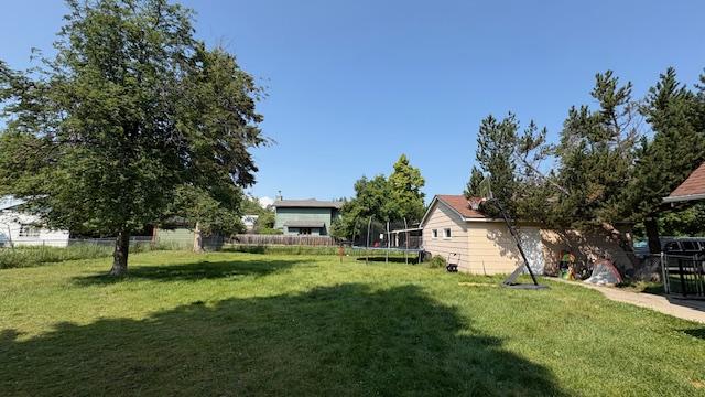 415 W 3rd St, Whitefish, MT 59937 - view of yard with a trampoline