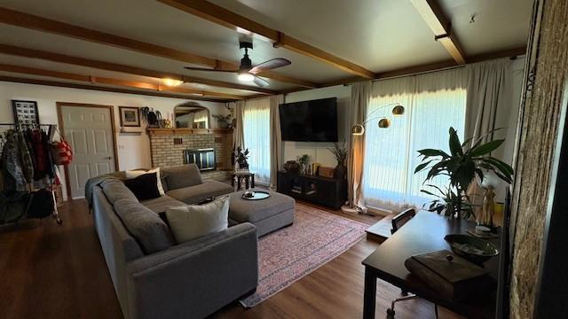 415 W 3rd St, Whitefish, MT 59937 - living room featuring ceiling fan, wood finished floors, a fireplace, and beamed ceiling