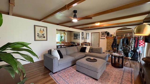 415 W 3rd St, Whitefish, MT 59937 - living room with wood finished floors, a ceiling fan, and beam ceiling