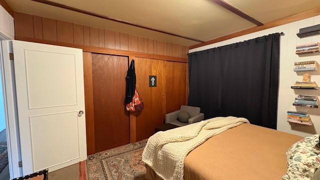 415 W 3rd St, Whitefish, MT 59937 - bedroom featuring a closet and wood walls