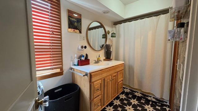 415 W 3rd St, Whitefish, MT 59937 - bathroom featuring vanity, curtained shower, and tile patterned floors