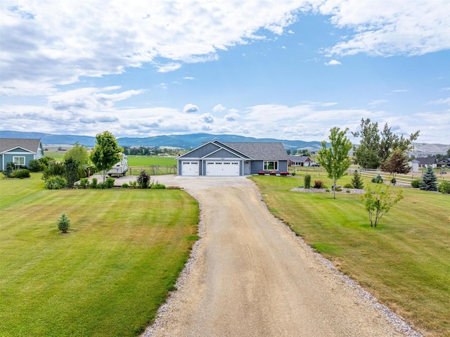 4460 Sunburst Ln, Stevensville, MT 59870 - single story home with driveway, a garage, a front yard, and a mountain view