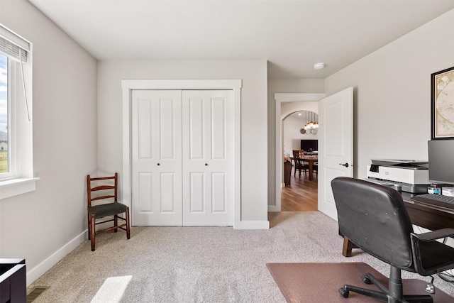 4460 Sunburst Ln, Stevensville, MT 59870 - carpeted home office featuring baseboards and a chandelier