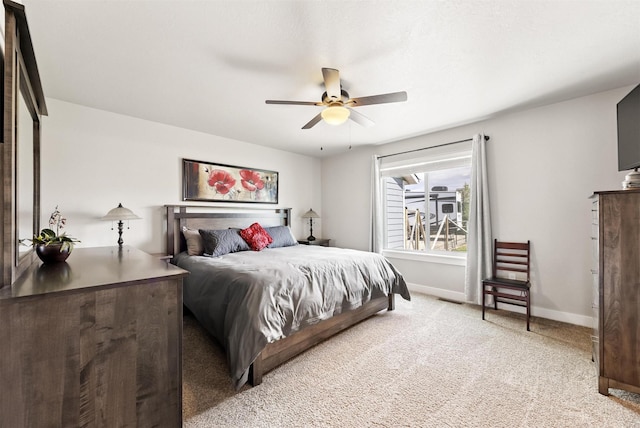 4460 Sunburst Ln, Stevensville, MT 59870 - bedroom with light colored carpet and a ceiling fan