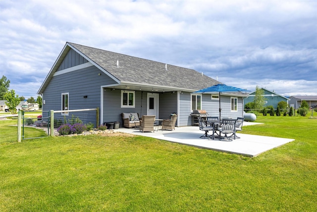 4460 Sunburst Ln, Stevensville, MT 59870 - back of property featuring a patio, roof with shingles, and board and batten siding
