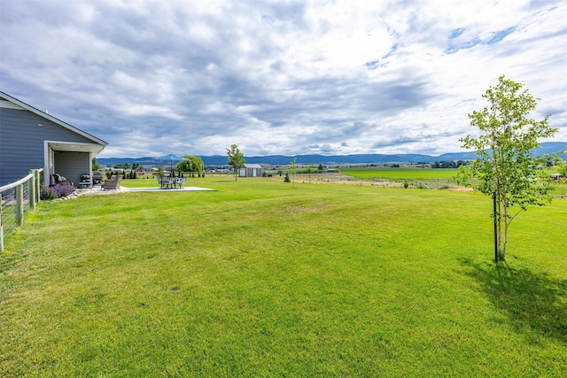 4460 Sunburst Ln, Stevensville, MT 59870 - view of yard with a patio and a mountain view