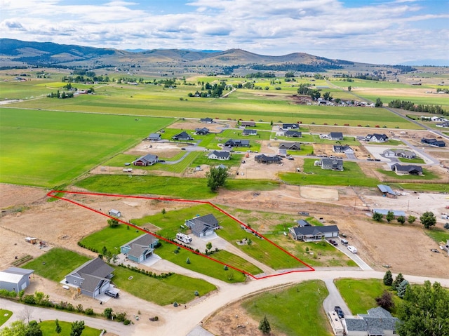 4460 Sunburst Ln, Stevensville, MT 59870 - aerial overview of property's location featuring a mountain backdrop and property boundaries highlighted