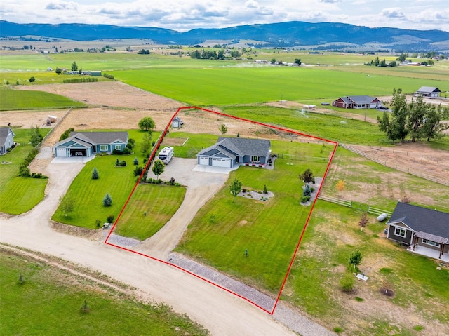 4460 Sunburst Ln, Stevensville, MT 59870 - overview of rural landscape with property boundaries highlighted and a mountain backdrop