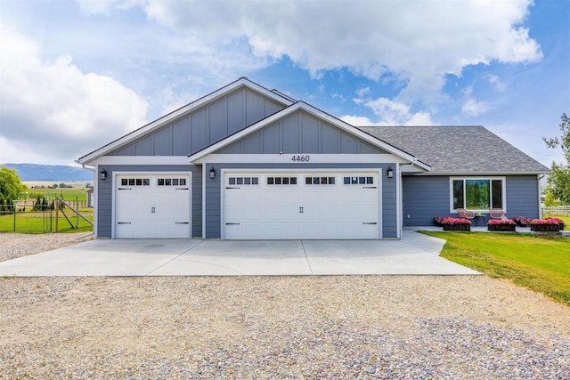 4460 Sunburst Ln, Stevensville, MT 59870 - view of front of house featuring concrete driveway, a garage, and a shingled roof