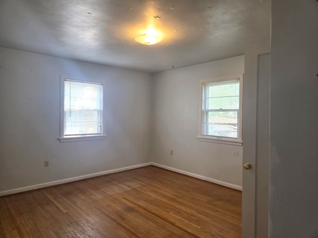 3017 5th Ave N, Great Falls, MT 59401 - spare room with wood finished floors and baseboards
