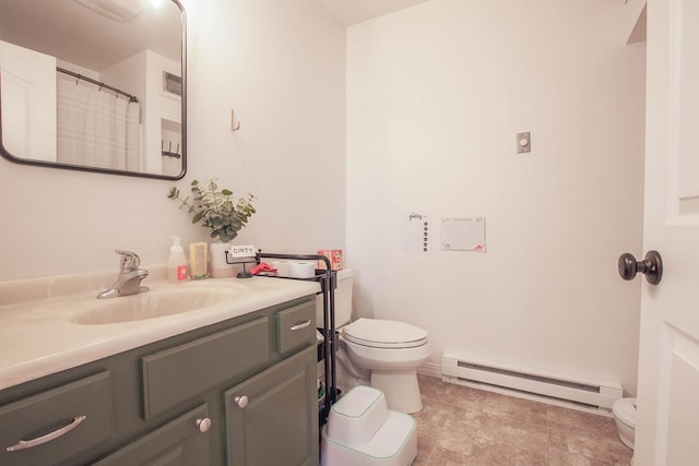 205 Kolczak Ln, Townsend, MT 59644 - bathroom featuring a baseboard heating unit, vanity, and stone finish flooring